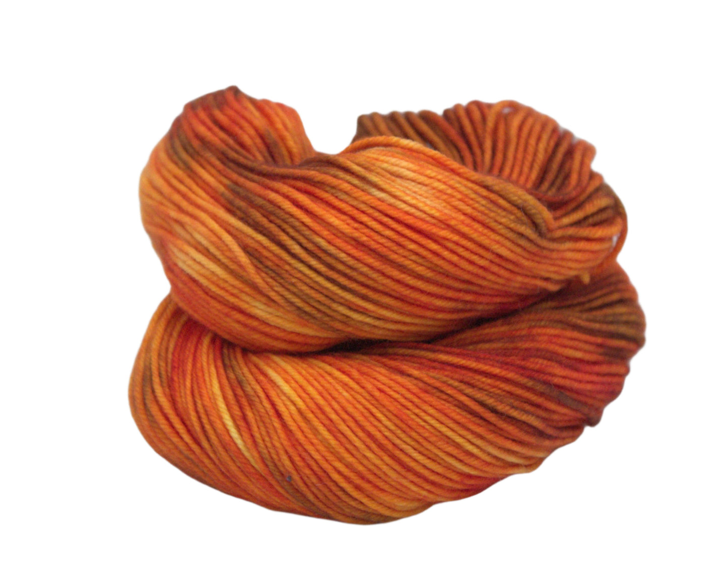 curled up skein of variegated orange and brown yarn on white background.