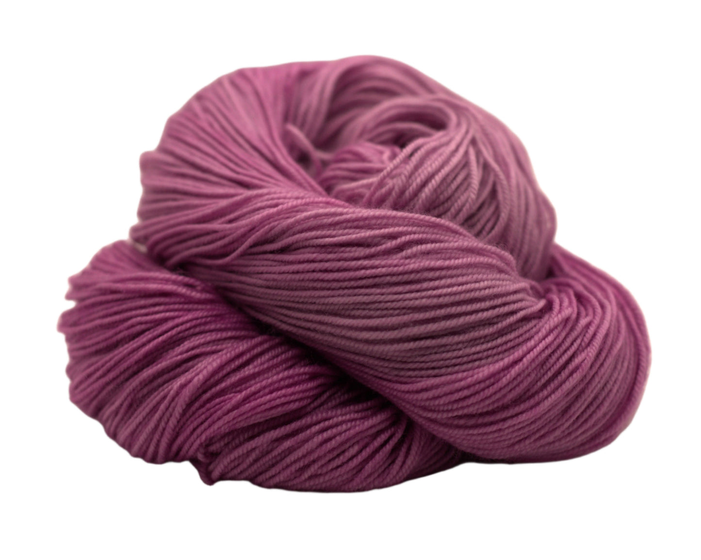 one curled up skein pink yarn on white background.