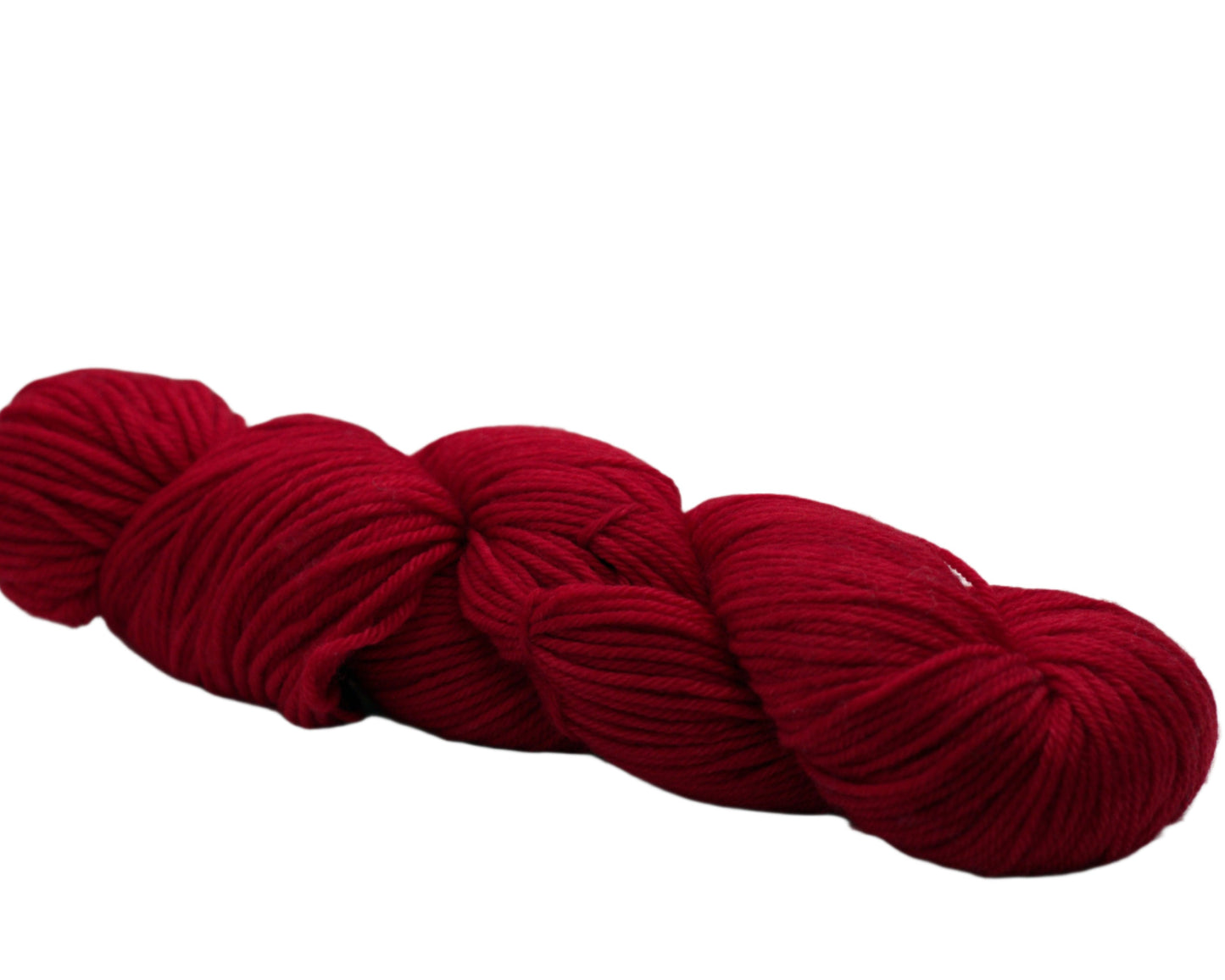 Side view of one twisted skein of lipstick red colored yarn on white background,