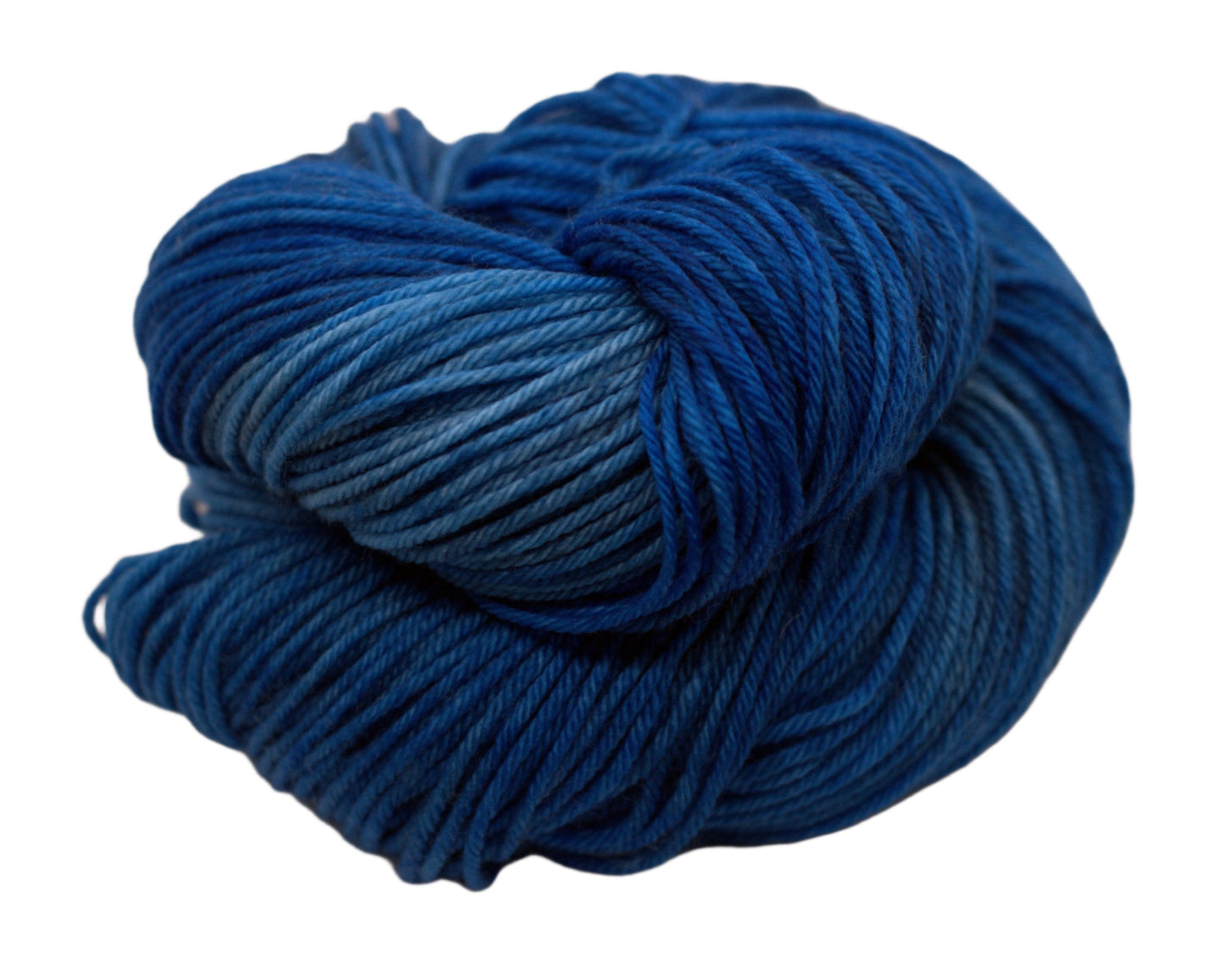 one curled skein tonal peacock blue yarn on white background.