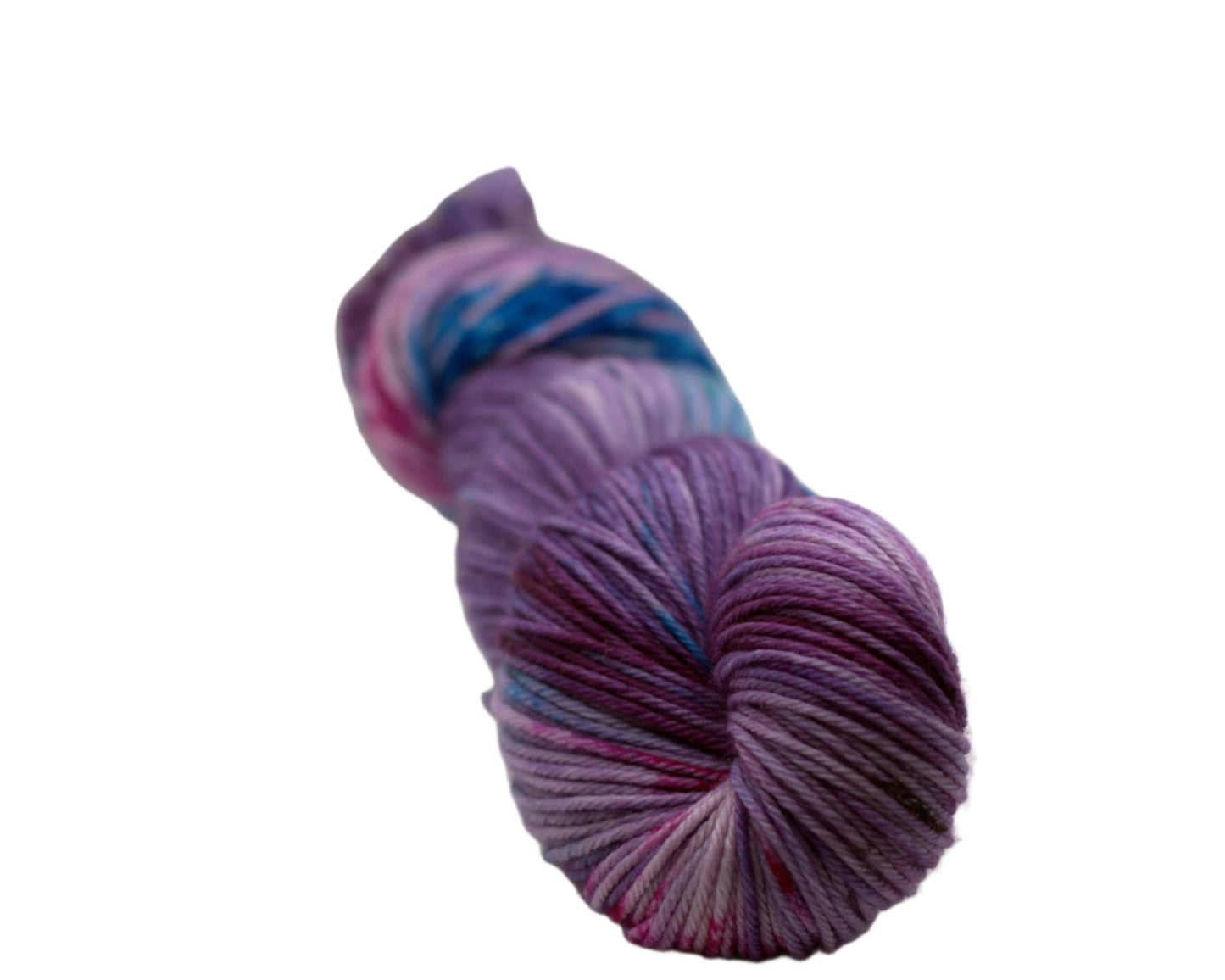 one twisted skein light purple yarn with turquoise, magenta and black speckles on white background.