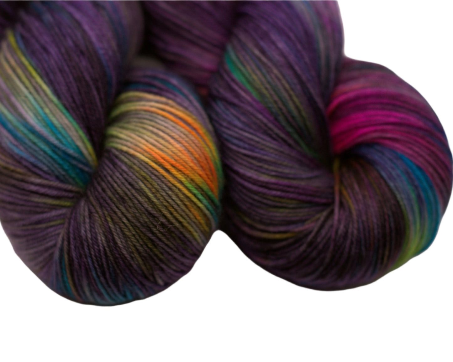 close up of two twisted skeins variegated dark purple yarn with neon colors on white background.