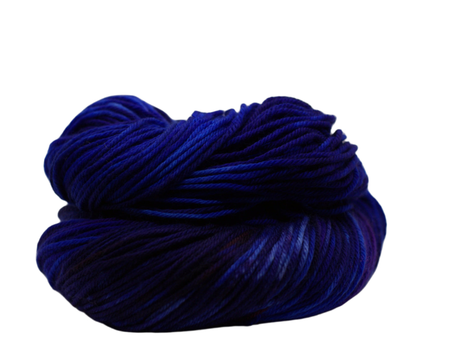 one curled skein of variegated blue, white and red yarn on white background.