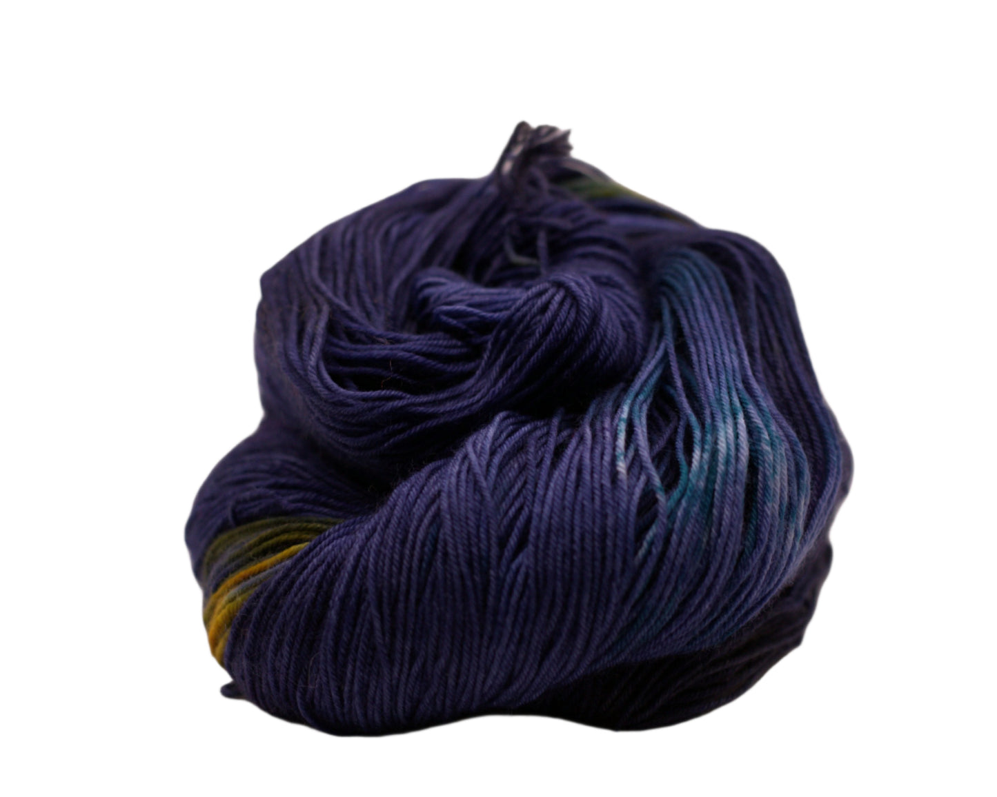 One curled skein navy blue, yellow and green variegated yarn on white background.