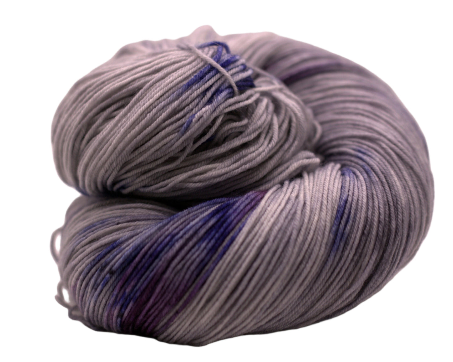 One curled skein of gray, blue and purple variegated yarn on white background.