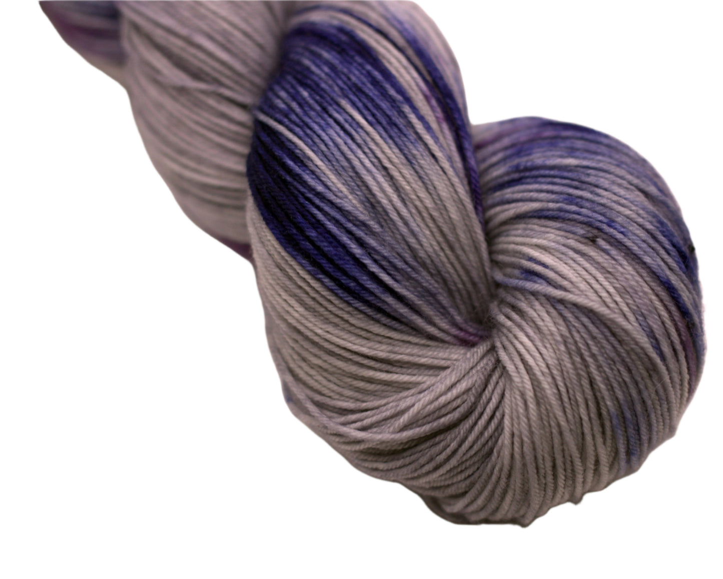 Close up of one twisted skein of gray, blue and purple variegated yarn on white background.