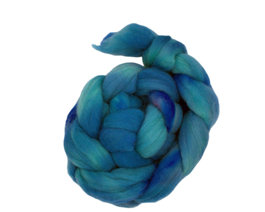 top view of braided combed top in multiple blues on white background.