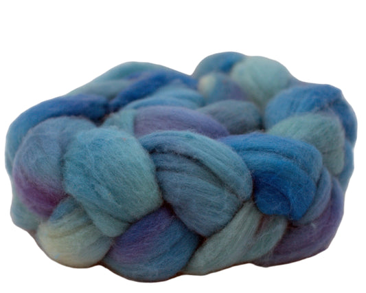 braided combed top in blues and purples  on white background.