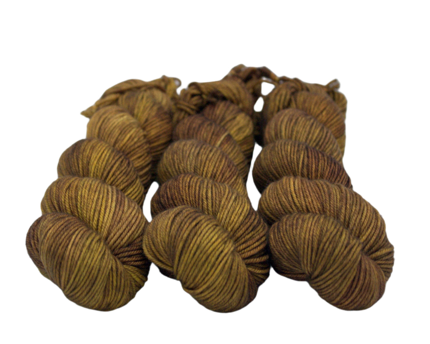 three twisted skeins tonal dark gold yarn on white background.