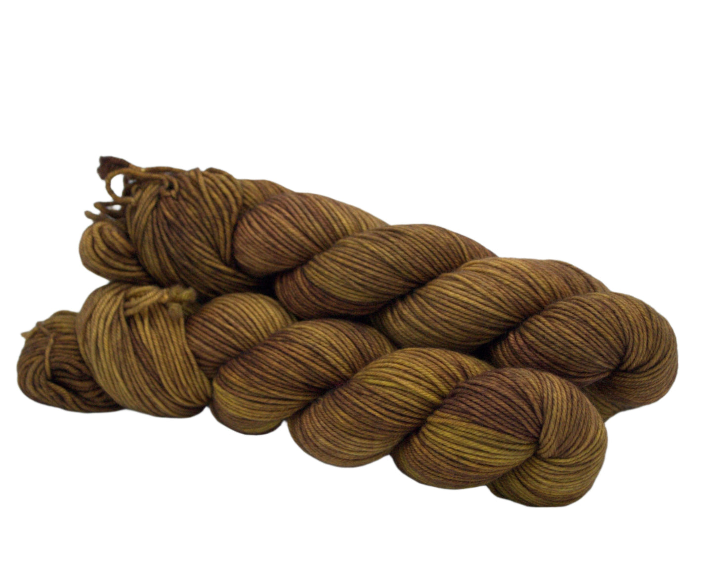 side view of three twisted skeins tonal dark gold yarn on white background.