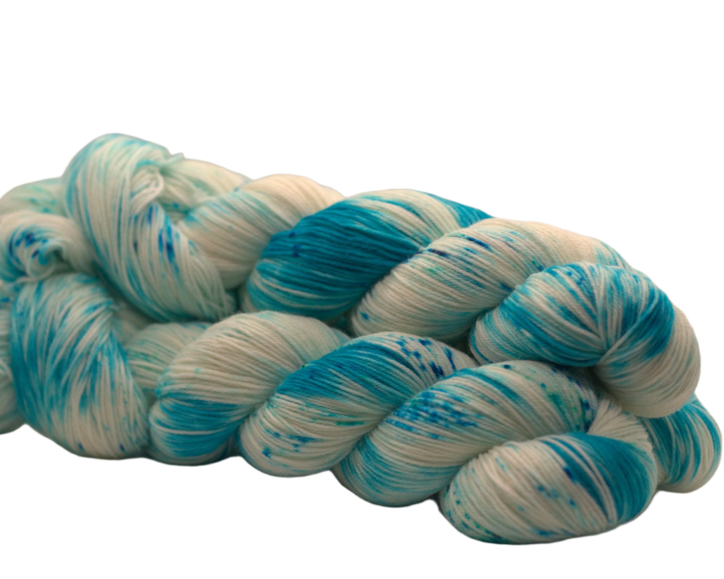 side view of three twisted skeins turquoise speckled yarn on white background.