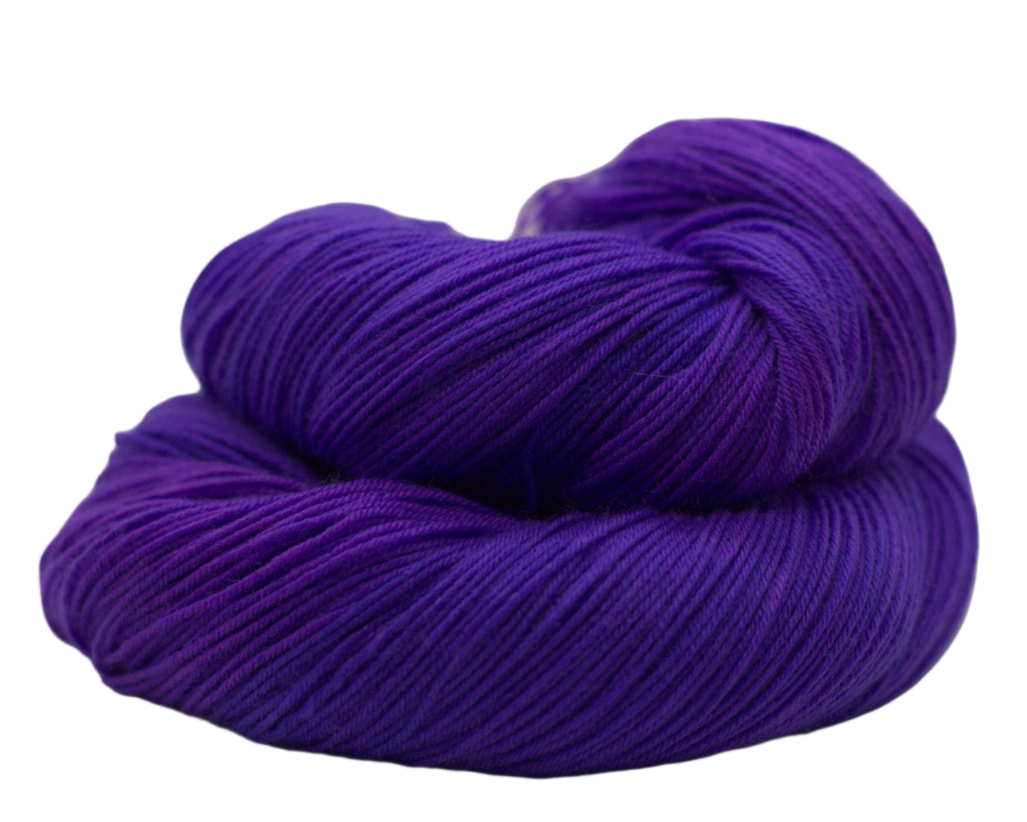 One curled up skein of purply-blue yarn on a white background.