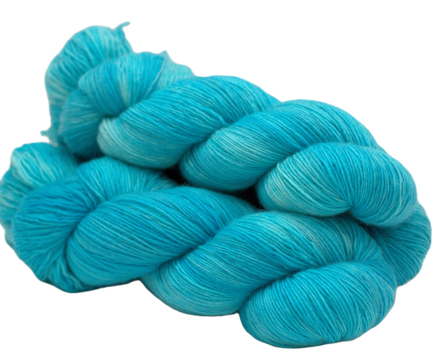 side view of three twisted skeins tonal turquoise yarn on white background.
