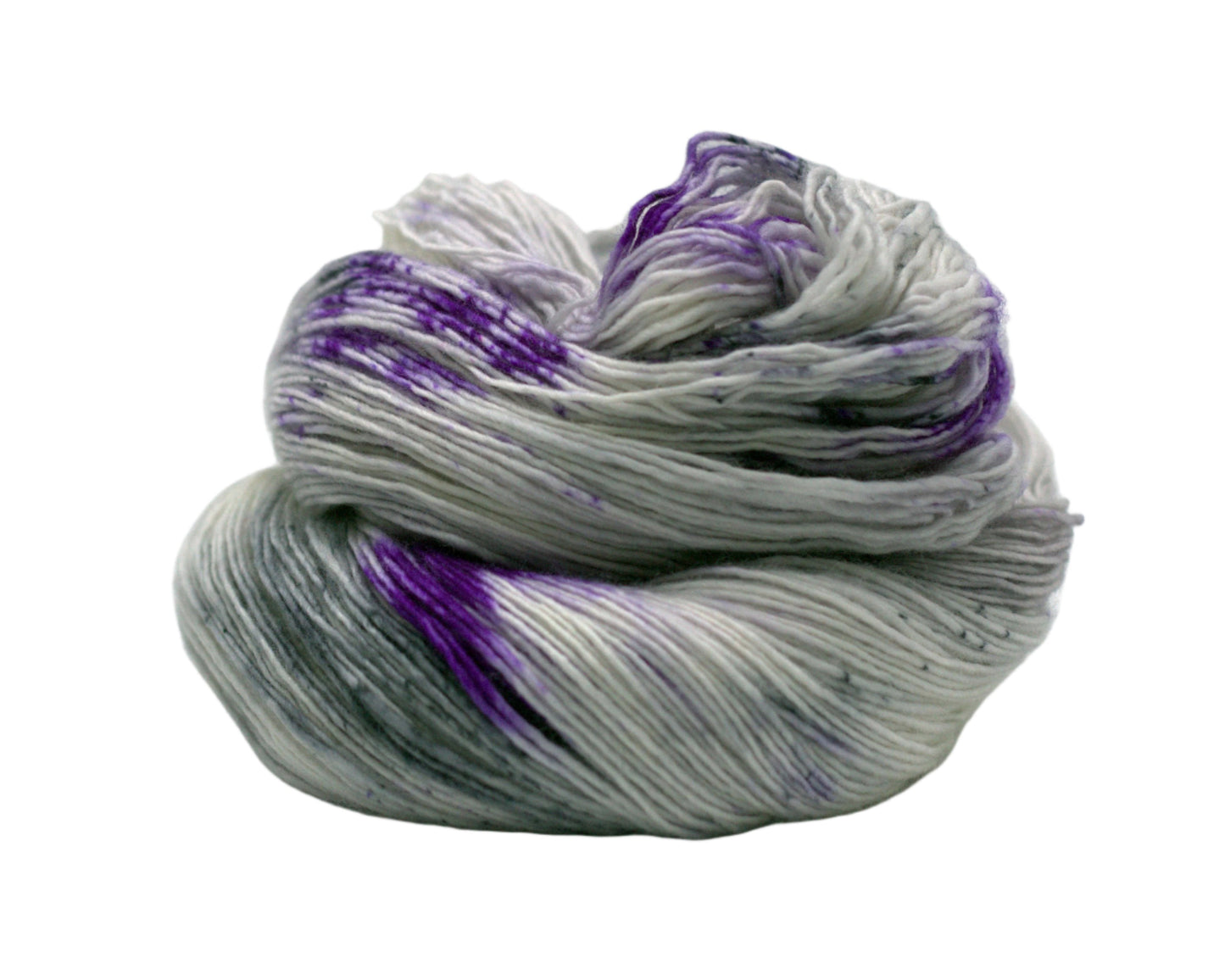 one skein curled up silver tonal yarn with purple and dark gray speckles on white background.