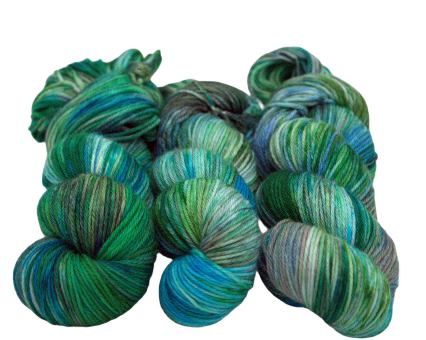 three twisted skeins variegated green, blue and brown yarn on white background.