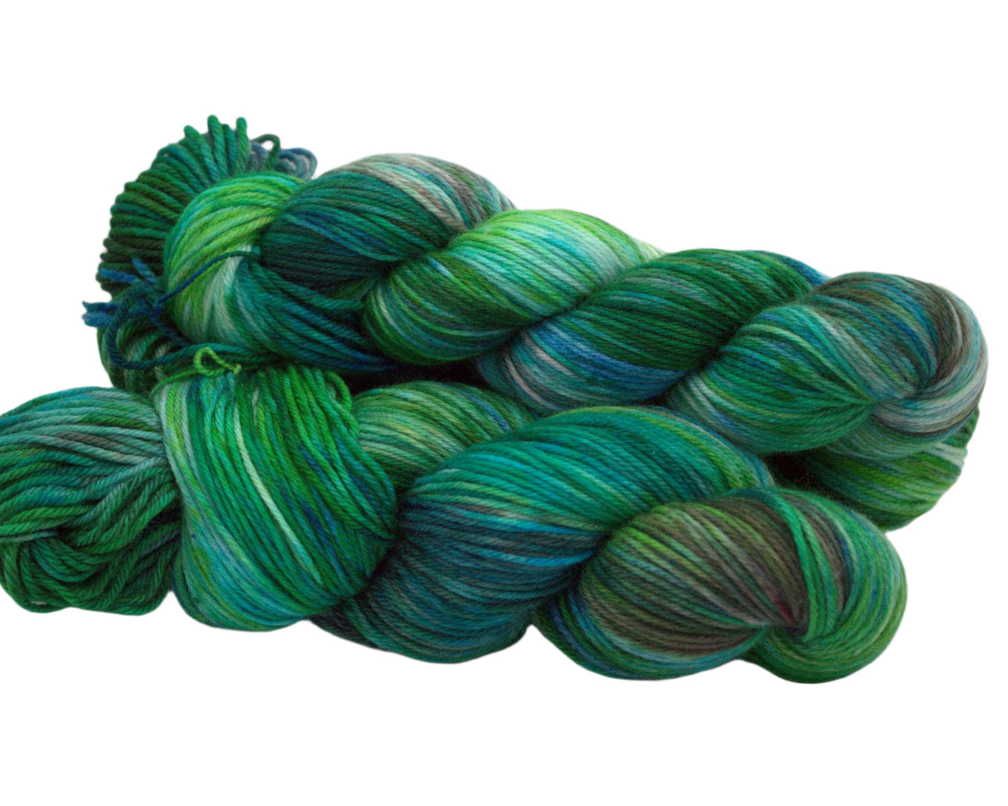side view of three twisted skeins variegated green, blue and brown yarn on white background.