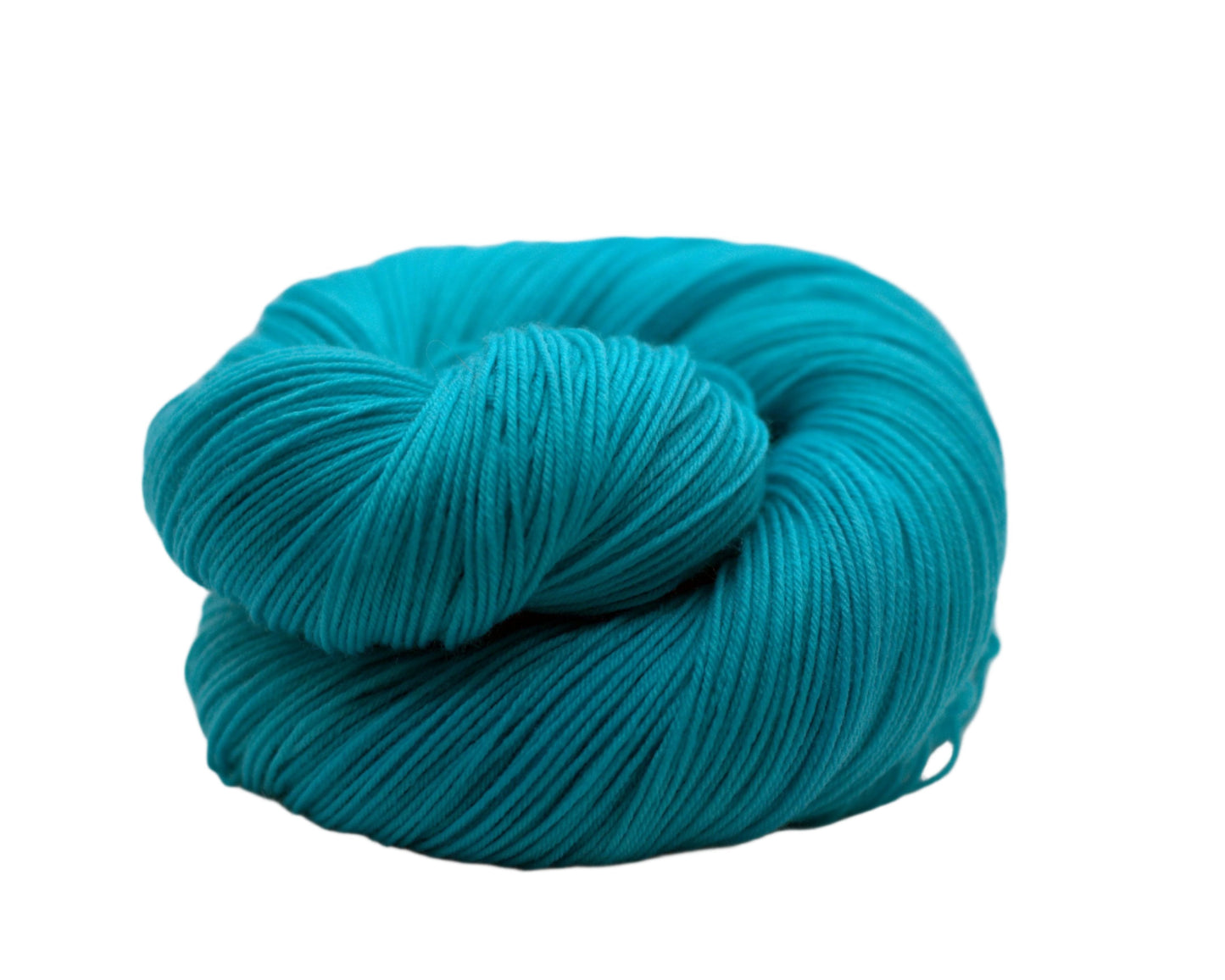 One curled up skein of aqua colored yarn on a white background