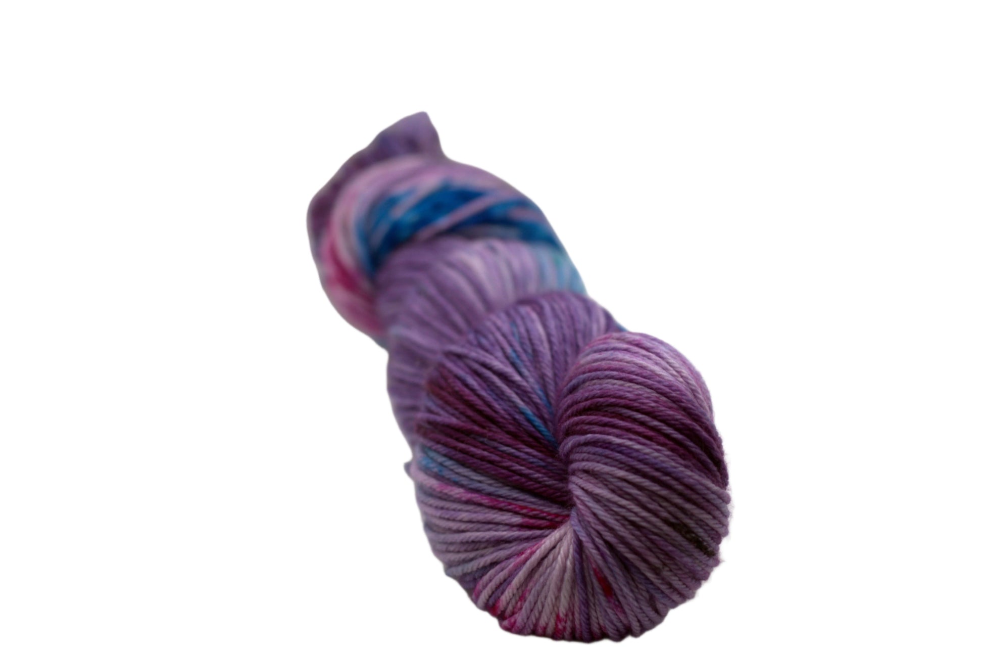 one twisted skein light purple yarn with turquoise, magenta and black speckles on white background.