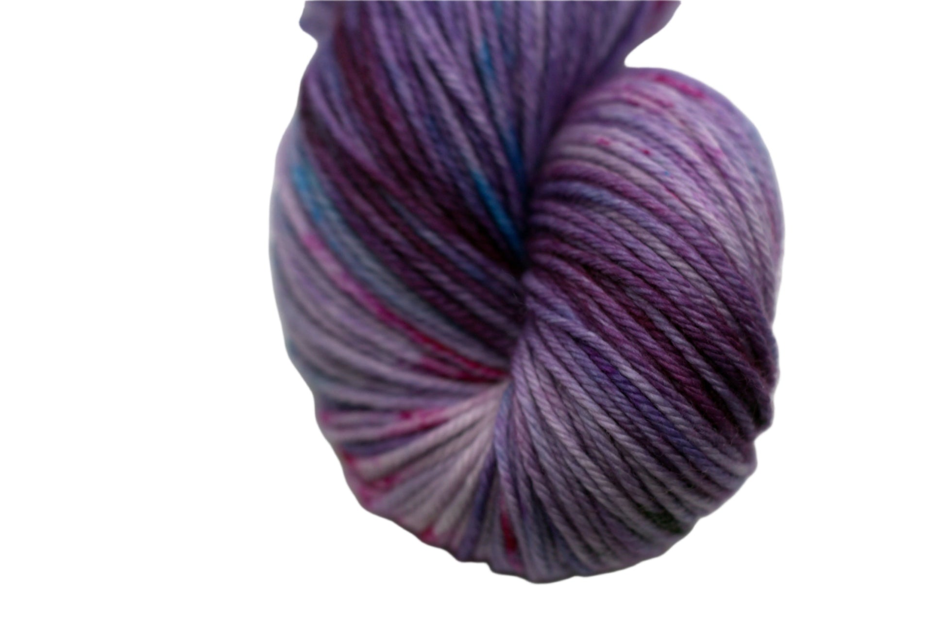 close up of one twisted skein of light purple yarn with turquoise, magenta and black speckles on white background.