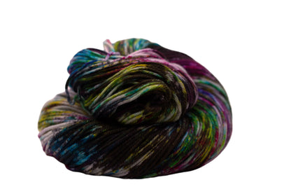 one curled up skein multicolored speckled yarn on white background.