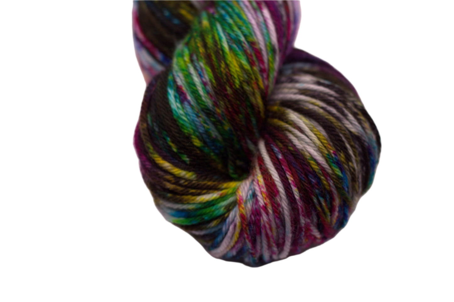 close up of twisted skein multicolored speckled yarn on white background.