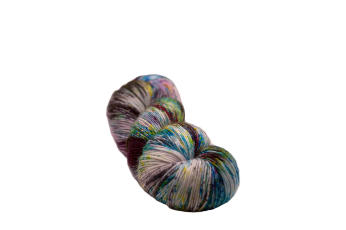 one twisted skein multicolored speckled yarn on white background.