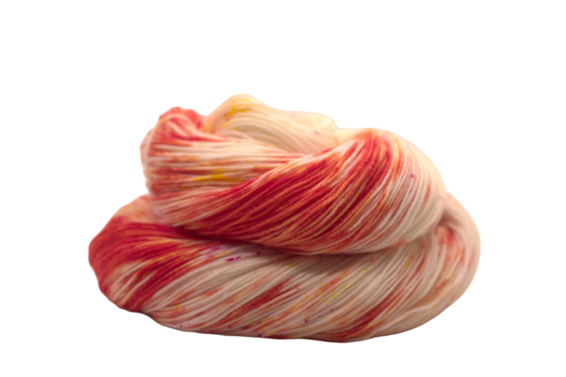 One curled skein orange, yellow and magenta speckled yarn on white background.