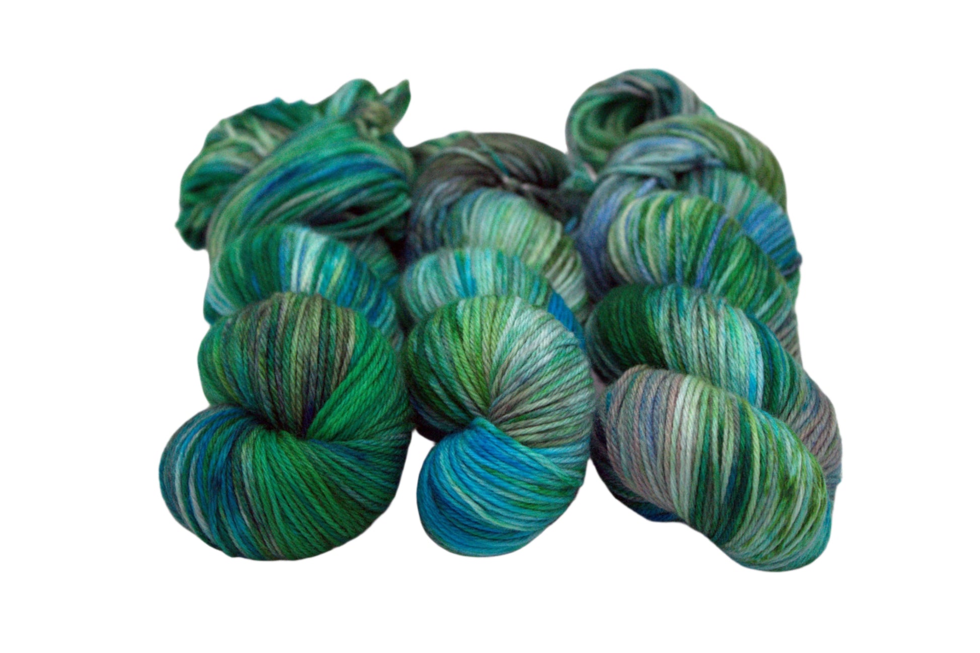 three twisted skeins variegated green, blue and brown yarn on white background.